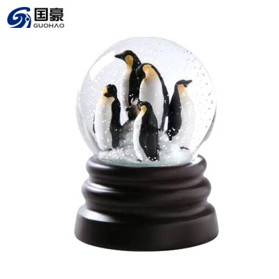 Resin penguin figurines snow globe